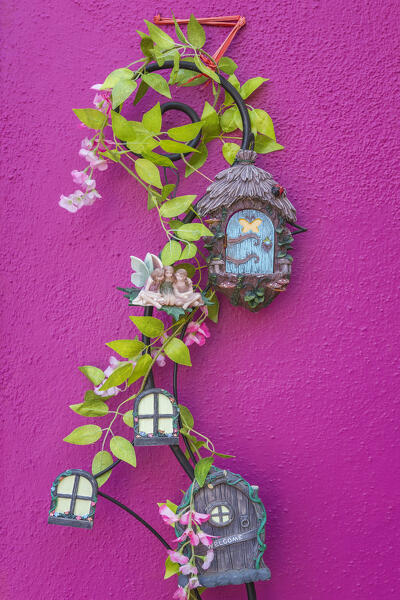 An adornment of a wall of a colorful house of Burano island, Venice, Veneto, Italy, Europe