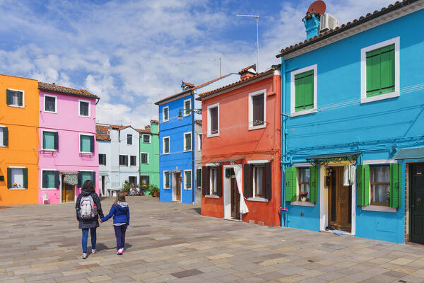 Mom and daughter visit Burano island, Venice, Veneto, Italy, Europe (MR)