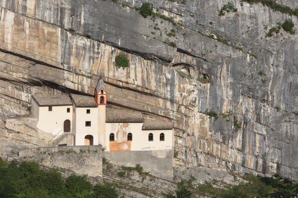 A view of Eremo di San Colombano, a monastery in Trambileno, Province of Trento, Italy, notable for its location in the side of a mountain. 