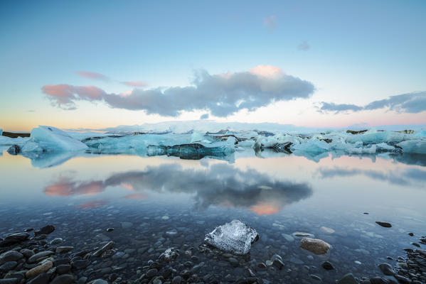 Jokulsarlon, Eastern Iceland, Iceland, Northern Europe. The iconic little icebergs lined in the glacier lagoon during a sunrise