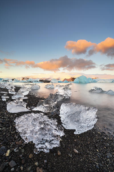Jokulsarlon, Eastern Iceland, Iceland, Northern Europe. The iconic little icebergs lined in the glacier lagoon during a sunrise