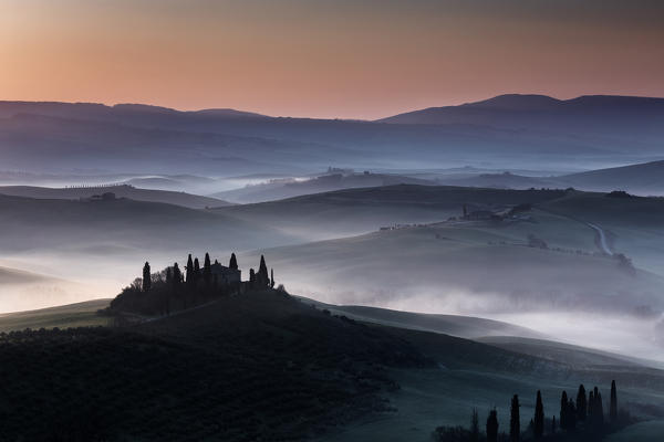 red sunrise in the hills, san Quirico d'orcia, val d'orcia, siena, tuscany, italy