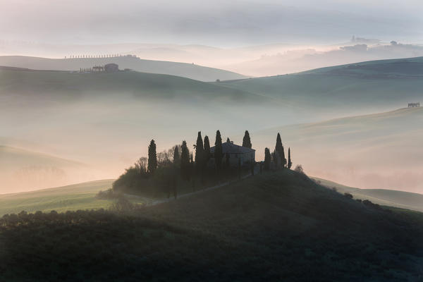 red sunrise in the hills, san Quirico d'orcia, val d'orcia, siena, tuscany, italy