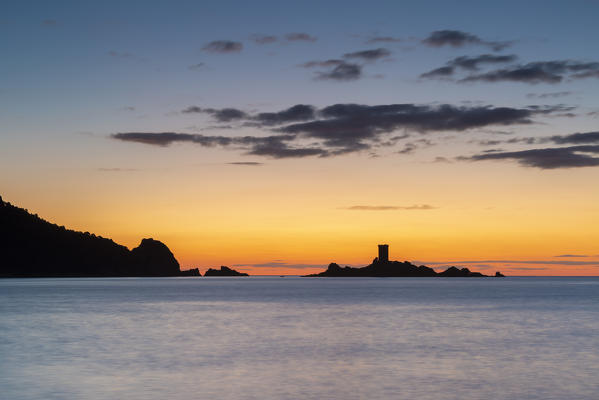The île d'Or silhouette at sunrise, viewed from Cap Dramont beach, Saint-Raphaël, Var department, Provence-Alpes-Côte d'Azur region, France