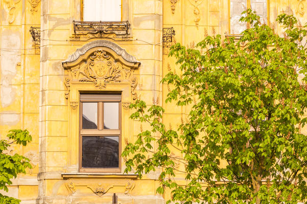 Close up of a yellow old building on Ljubljanica riverside. Ljubljiana, Osrednjeslovenska, Slovenia