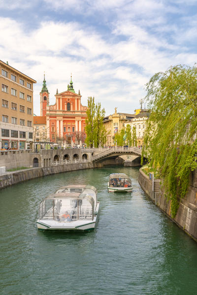 Touristic boats sailing Ljubljanica river. Ljubljiana, Osrednjeslovenska, Slovenia