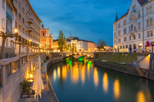 Old town and triple bridge reflected on Ljubljanica river. Ljubljiana, Osrednjeslovenska, Slovenia