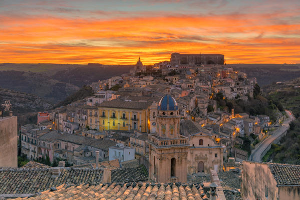 Close up of a typical rooftop with the enchanting hilltop city of Ragusa Ibla in the background at sunrise, Ragusa, Sicily, Italy