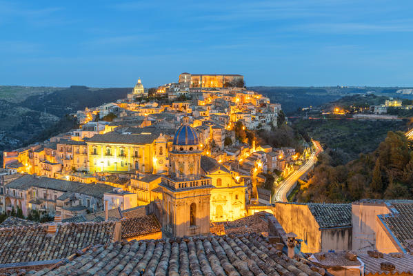Elevated view of the church of Santa Maria dell'Itria and Ragusa Ibla in the background at dusk, Ragusa, Sicily, Italy