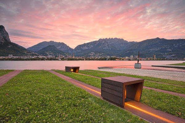 sunrise on the lakeside in front of Lecco,malgrate, lecco province, lombardy, north italy, italy