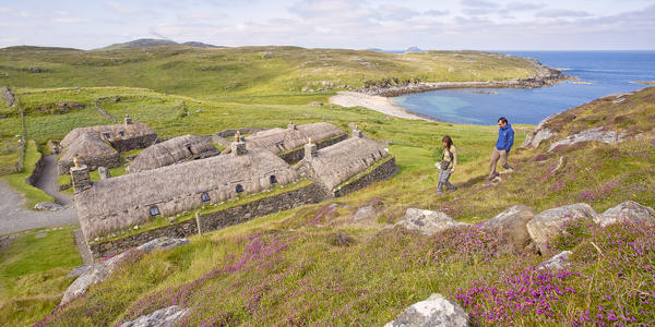 Tourists at Gearrannan Blackhouse Village, Carloway,Isle of Lewis, western scotland,United Kingdom