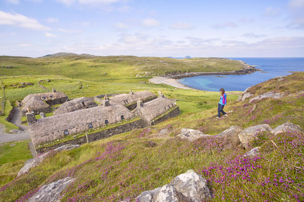 Tourist at Gearrannan Blackhouse Village, Carloway,Isle of Lewis, western scotland,United Kingdom