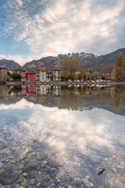 Pescarenico and Resegone mount reflected in the river Adda, Lecco, Lecco province, Lombardy, Italy