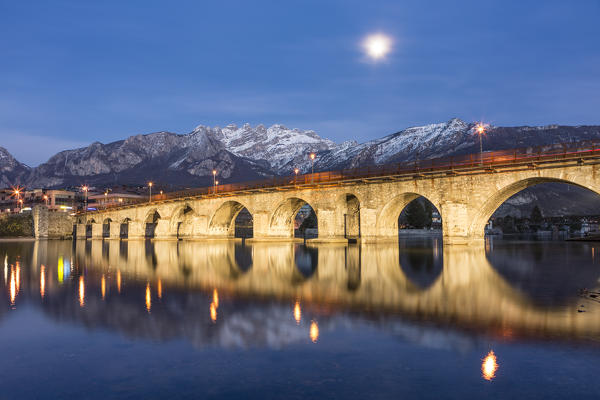The old bridge of Lecco and Resegone mountain at dusk, Lecco, Lecco province, Lombardy, Italy