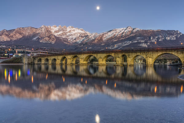 The old bridge of Lecco and Resegone mountain at dusk, Lecco, Lecco province, Lombardy, Italy