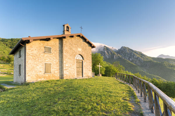Little chapel of San Tomaso at sunrise light, Valmadrera, Lecco Province, Lombardy, Italy