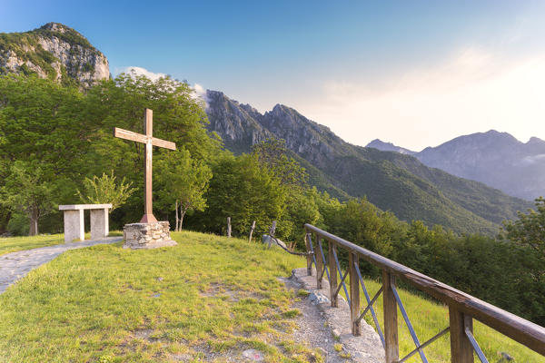 The cross of San Tomaso at sunrise light, Valmadrera, Lecco Province, Lombardy, Italy