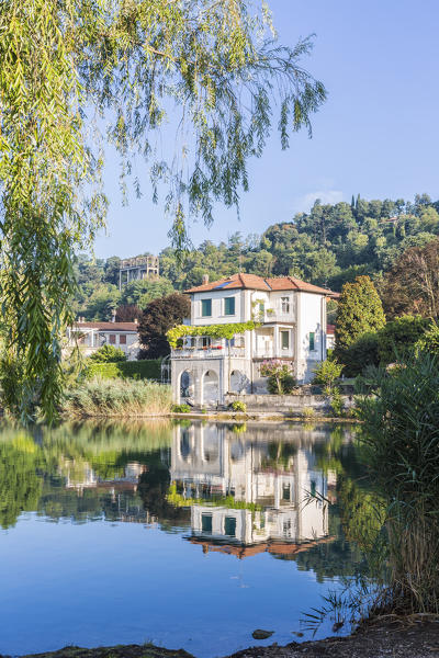 House reflected in the Pusiano lake, Como Province, Lombardy, Italy