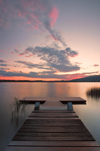 Wood pier on Pusiano lake at sunset, Bosisio Parini, Lecco province, Lombardy, italy