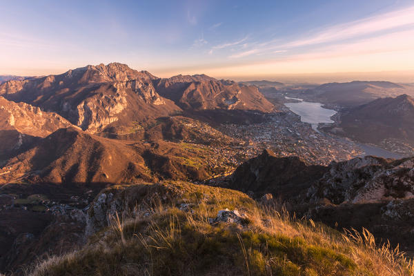 Overview of Lecco Lake and Adda river from Coltignone mount at dusk, Lecco Province, lombardy, italy