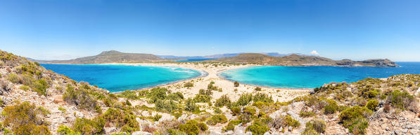 The narrow stretch of white sand which divides Simos beach viewed from a ridge, Elafonissos, Laconia Region, Peloponnese, Greece