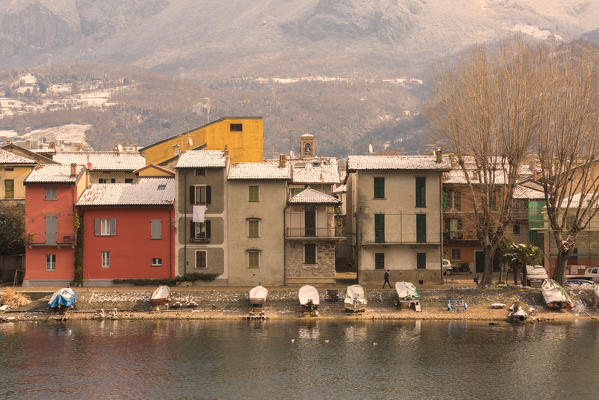 Snowy houses of Pescarenico on Adda river, Lecco province, Lombardy, Italy