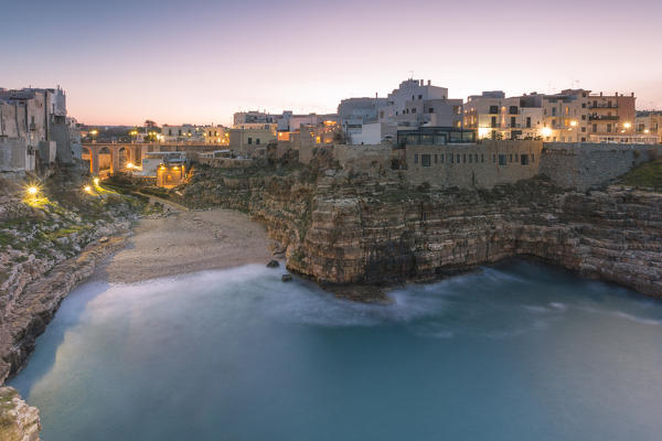 Lama Monachile also called Cala Porto at dusk, Polignano a Mare, Bari province, Apulia region, Italy