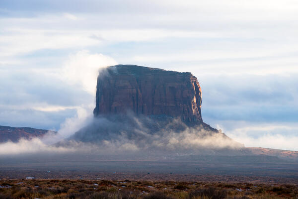 Foggy sunset in Monument Valley Tribal Park, Utah, Usa