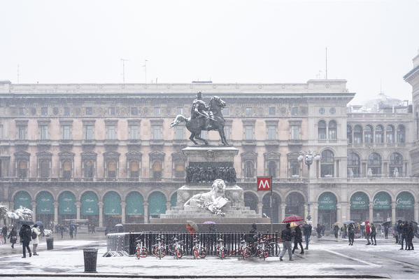 The monument in Piazza Duomo in winter during snowfall, Milan, Lombardy, Italy, Europe