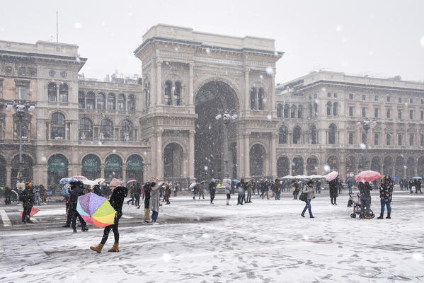 The gallery of Vittorio Emanuele II and Piazza Duomo in winter during snowfall, Milan, Lombardy, Italy, Europe
