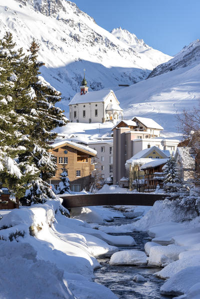 The little church and the river in Andermatt, Canton of Uri, Switzerland, Europe