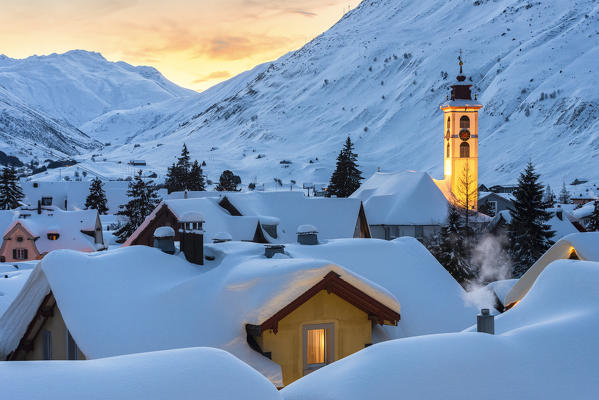 The alpine village of Andermatt in the winter evening, Canton of Uri, Switzerland, Europe