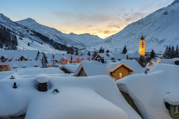 The alpine village of Andermatt during the sunset in winter, Canton of Uri, Switzerland, Europe