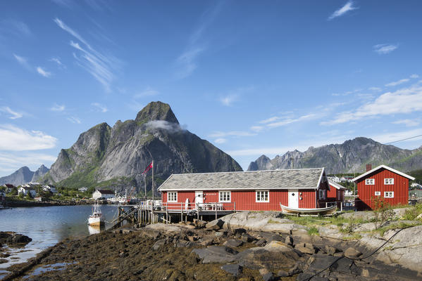 Typical houses of fishermen and in background the mountains, Reine, Moskenes, Lofoten Islands,Norway, Europe