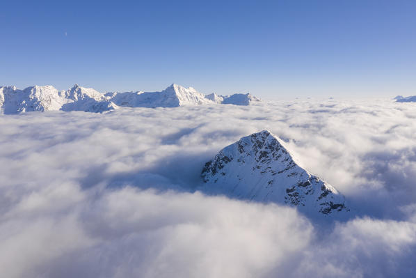 Aerial view of Piz Campasc that it is enclose from clouds, Bernina Pass, Engadin, Canton of Graubunden, Switzerland, Europe