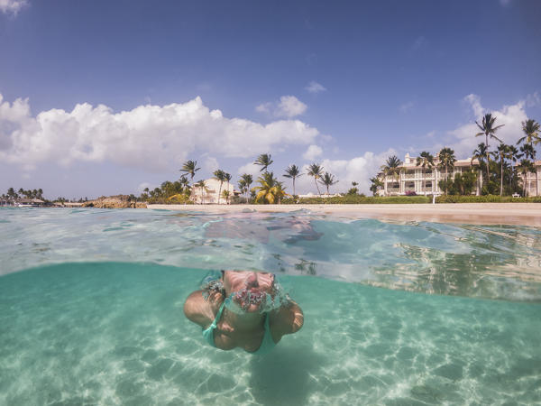 Woman swims underwater in the clear sea , Heywoods Beach, Douglas, Barbados Island, Lesser Antilles, West Indies, Caribbean region