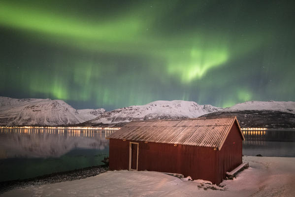 The Northern Lights above a typical Rorbu, Lyngen Alps Tromsø, Norway, Europe