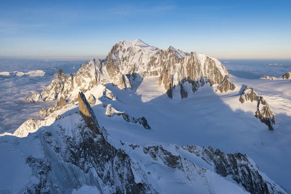 Aerial view of snowy peaks of Mont Blanc and Dent du Geant during sunrise, Courmayeur, Aosta Valley, Italy, Europe