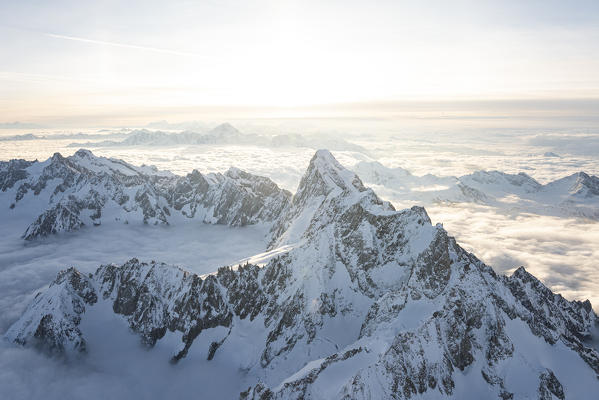 Aerial view of snowy peaks of Mont Blanc and Dent du Geant during sunrise, Courmayeur, Aosta Valley, Italy, Europe