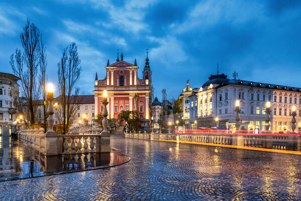 Tromostovje (Triple bridge) and Franciscan Church of the Annunciation in the center of Ljubiana, Slovenia, Europe 
