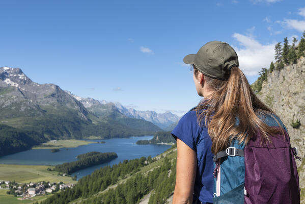 Woman admires the beautiful landscape of Silvaplana, Silvaplana, Engadin, Canton of Graubunden, Switzerland (MR)