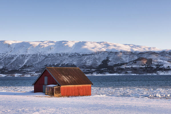 Typical fisherman houses in front of a fjord near Tromso,Troms county, Norway, Europe