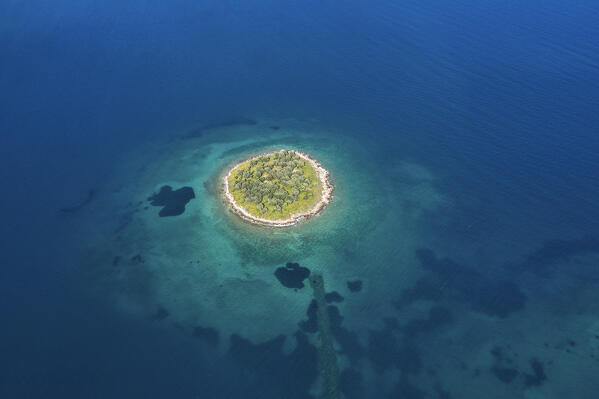 The st. Athanasios island in a blue sea, Greece