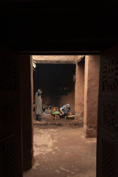 Tradizional family preparing bread in a typical berber house, Marrakech-Safi, Morocco