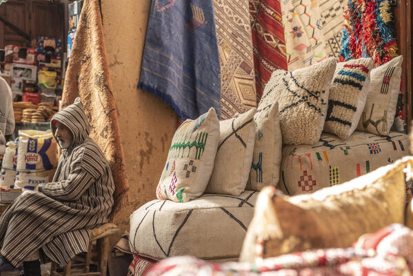 A begging among the shops of Marrakech, Morocco, Africa