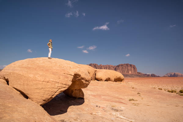 A girl observing the Wadi rum desert, south Jordan, Middle east, Asia