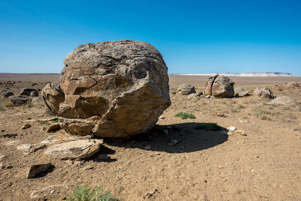 Geological spherical rock formations in the place known as Valley of Balls at Caspian Depression desert, Aktau, Mangystau region, Kazakhstan