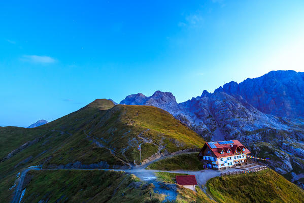Summer sunrise at the Rifugio Marinelli, below the Monte Coglians and the Creta delle Chianevate, in the Carnic Alps, Udine province, Friuli Venezia-Giulia region, Italy