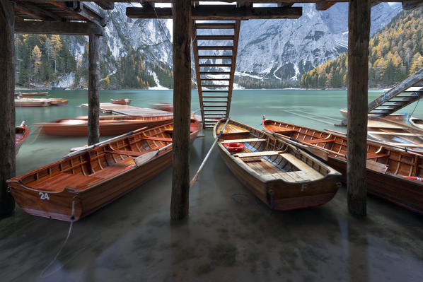 The floating dock and boats at Braies Lake, Natural Park fanes-sennes-braies, Bolzano province, Trentino Alto Adige district, Dolomites, South Tyrol, Italy, Europe.