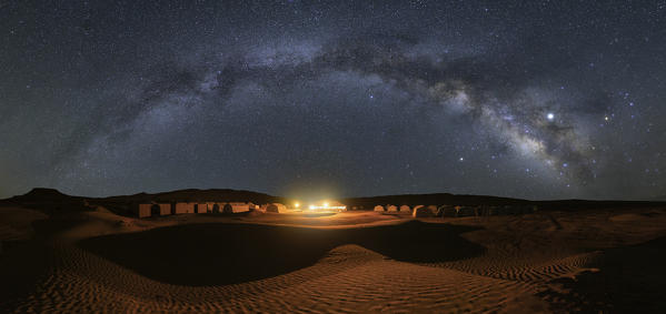 Milky way over Camp Mars village in the sand dunes, Sahara desert, Tunisia, Northern Africa.